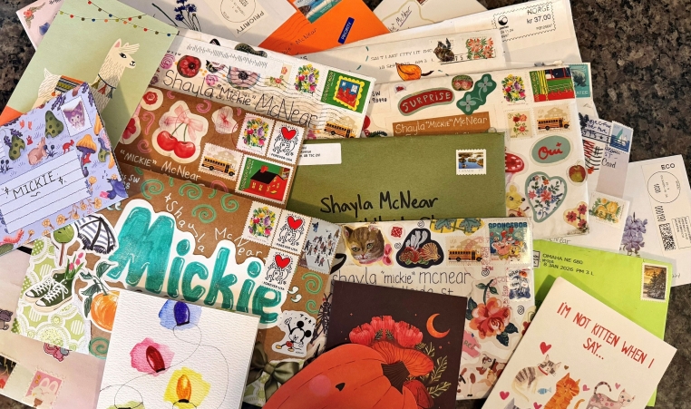 A pile of physical letters to camp