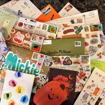 A pile of physical letters to camp