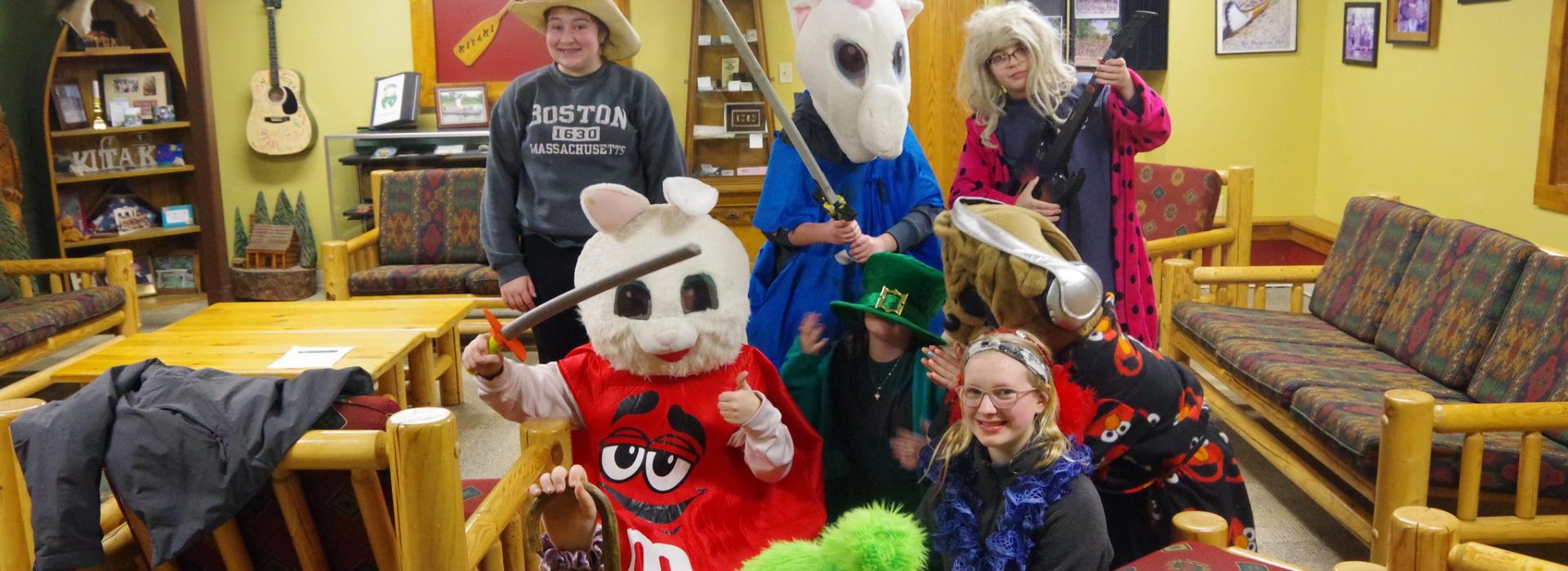 A group of campers in crazy costumes