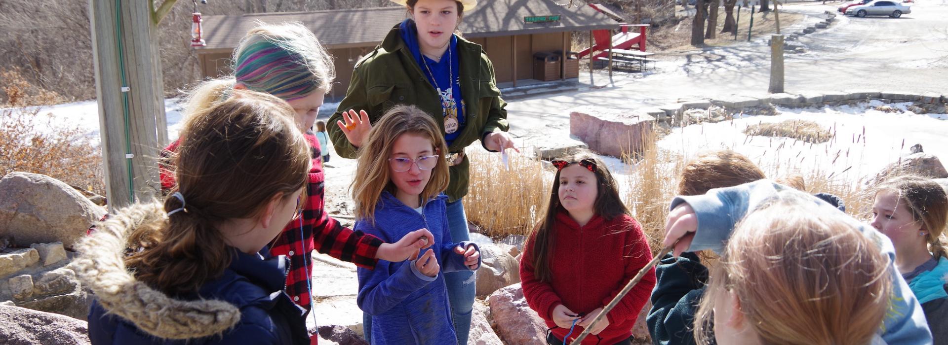 Campers play a game in front of character in an all camp game