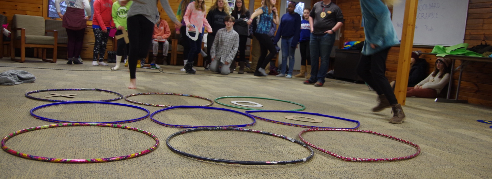 Campers participate in a relay playing tic tac toe